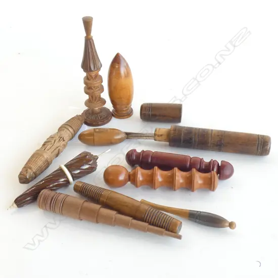 Eleven vintage treen needlecases.